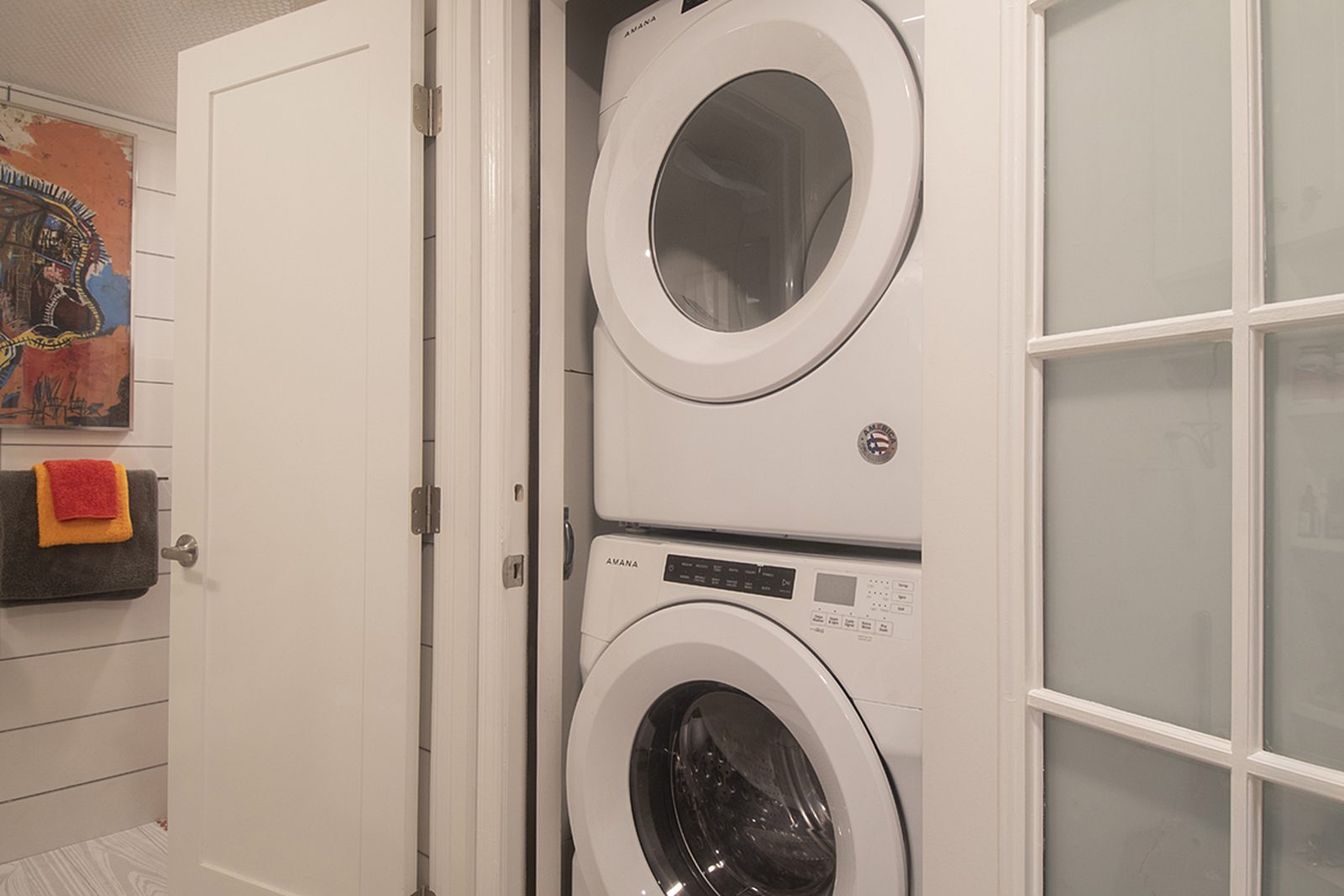 Unit D's in-unit stacked washer and dryer.