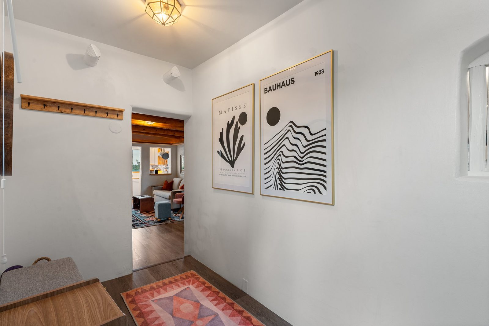 The casita entry today: clean plaster, timber trim and light coming through from the room beyond.